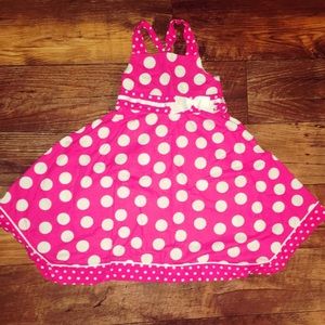 Girl’s pink polka dot dress